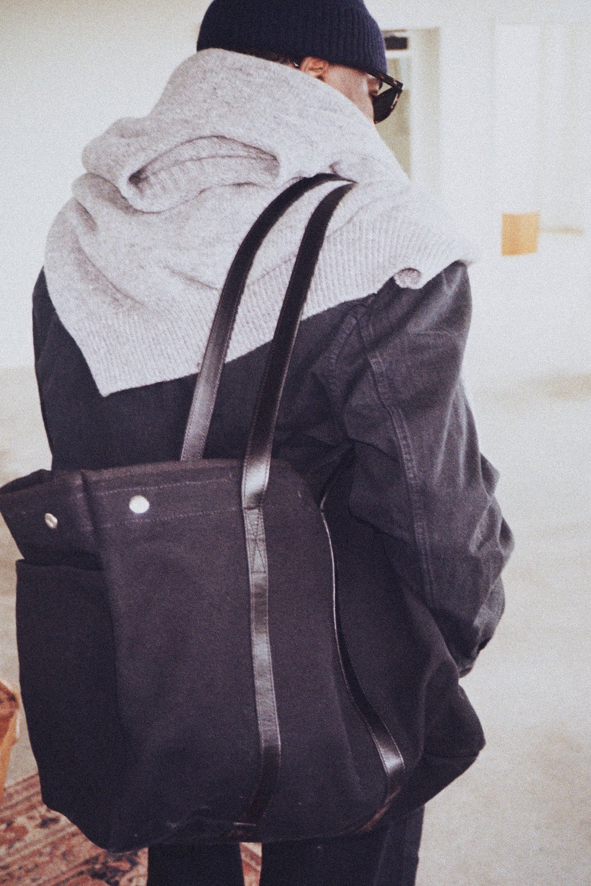 Black Canvas Tote worn over the shoulder